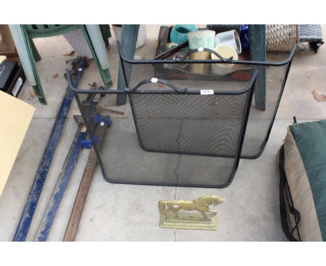 A VINTAGE BRASS HORSE DOOR STOP AND TWO METAL FIRE SCREENS 