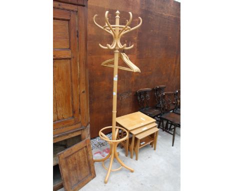 A BENTWOOD COAT/STICK STAND AND FIVE WOODEN HANGERS 