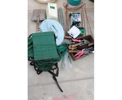 AN ASSORTMENT OF GARDEN ITEMS TO INCLUDE PLANT SUPPORTS, HAND TOOLS AND NETTING ETC 