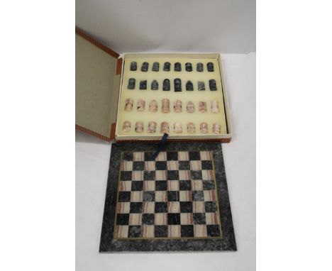 A VINTAGE MARBLE CHESS BOARD AND CHESS PIECES - COMPLETE 
