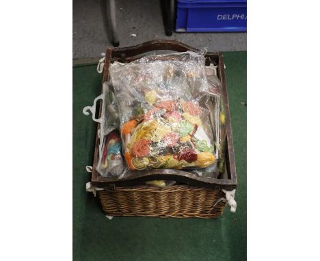 A LARGE BASKET OF TAPESTRY WOOL 