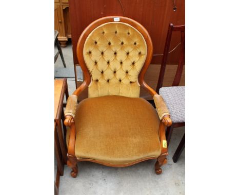 A VICTORIAN STYLE BUTTON SPOON BACK LOUNGE CHAIR WITH SWEPT OPEN ARMS 