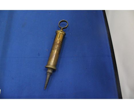 A VINTAGE BRASS  SYRINGE WITH MAKERS CREST 