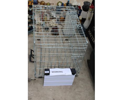 A METAL DOG CRATE AND A SIGN MAKING LIGHT BOX 