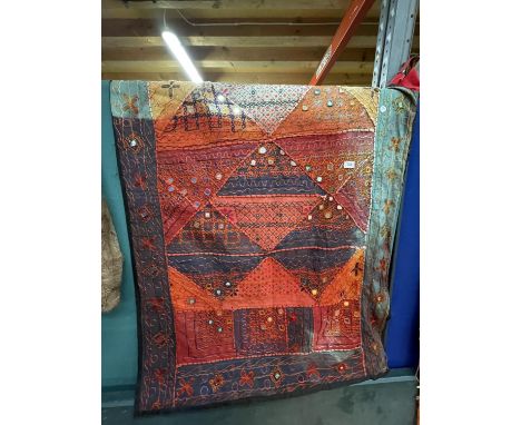 A RED AND TURQUOISE TAPESTRY, 98CM X 144CM 