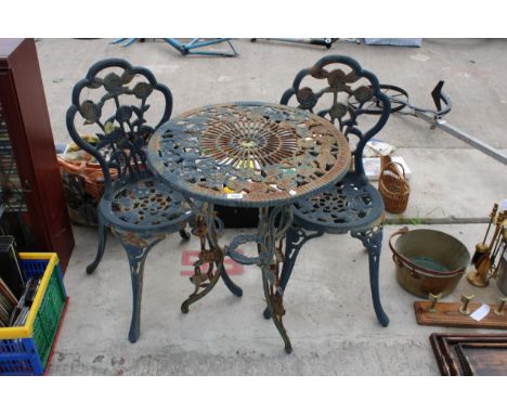 A VINTAGE STYLE CAST METAL BISTRO SET COMPRISING OF A ROUND TABLE AND TWO CHAIRS 