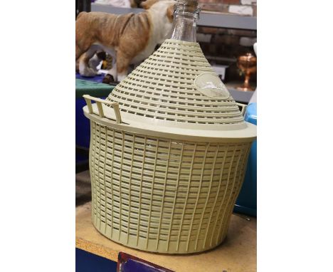 A VINTAGE FIVE GALLON DEMIJOHN AND BASKET 