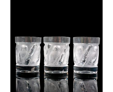 A set of 3 clear and frosted drinkware adorned with raised owls. Lalique France etched on base. Dimensions: 3"W x 4"HManufact