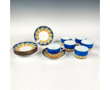 Discontinued pattern. Elegant and lightweight porcelain flat cup set. Design features a cerulean blue ground with abstract ge