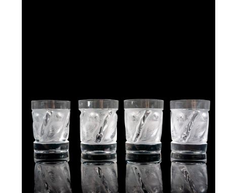 A set of 4 clear and frosted drinkware adorned with raised owls. Lalique France etched on base. Dimensions: 3"W x 4"HManufact