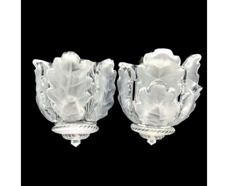 A set of two wall sconces that have three fogged crystal detachable oak leaves as the centerpiece with a round fogged crystal