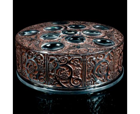 Opalescent cabochon and black enamel edged top surrounded with exotic bird panels and fruiting vine work. Marked Lalique Fran
