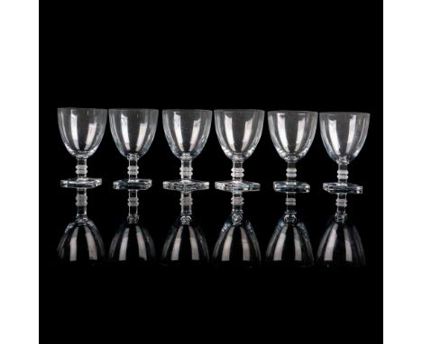 A set of 6 clear drinkware with a square stem adorned with zigzag pattern. Lalique France etched on base. Issued: c. 1939-202