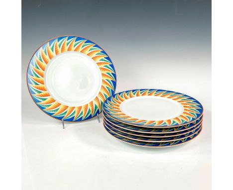 Discontinued pattern. Elegant and lightweight white porcelain charger plate set. Design features cerulean blue rims with abst