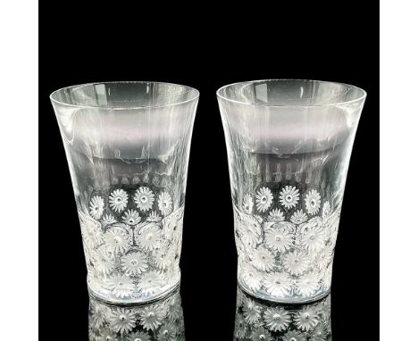 Two elegant clear crystal glasses with flower design. Lalique France etched mark. Dimensions: 5"H x 3.5"diaManufacturer: Lali