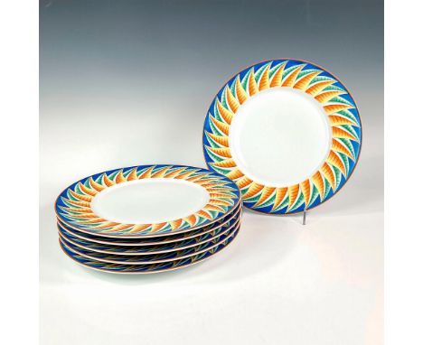 Discontinued pattern. Elegant and lightweight white porcelain charger plate set. Design features cerulean blue rims with abst