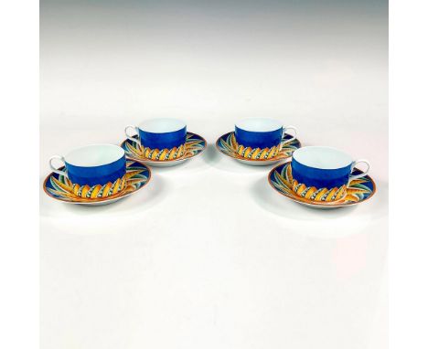 Discontinued pattern. Elegant and lightweight porcelain flat cups with saucers. Design features a cerulean blue ground with a