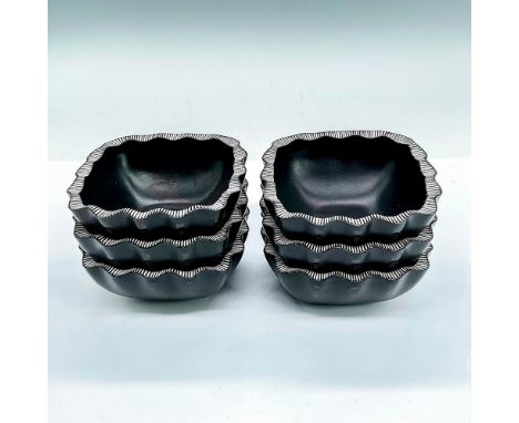 Six small black glass bowls with a scalloped striped rim. Lalique France etched mark. Dimensions: 4.5"L x 4.5"W x 1.75"HManuf