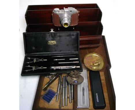 A collectors lot to include a modern letter rack, a brass blotter and small brass letter rack, a box containing various pens 