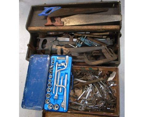 A carpenters wooden case containing a variety of vintage tools to include wooden planes, saws etc.