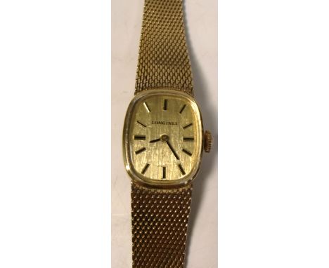 Longines; a 1960s ladies dress watch with gold filled case, matching integral gold filled bracelet and high grade calibre 560