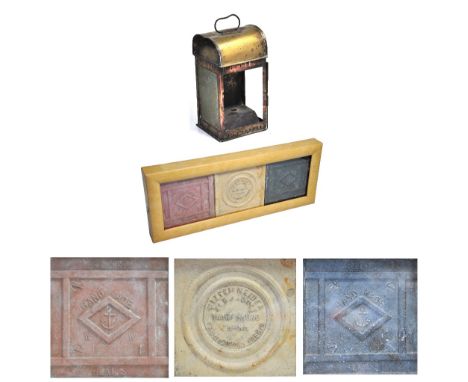 A brass ships lantern from "Brentwood" and a set of three ceramic floor tiles from a wreck in the North Sea all framed and gl