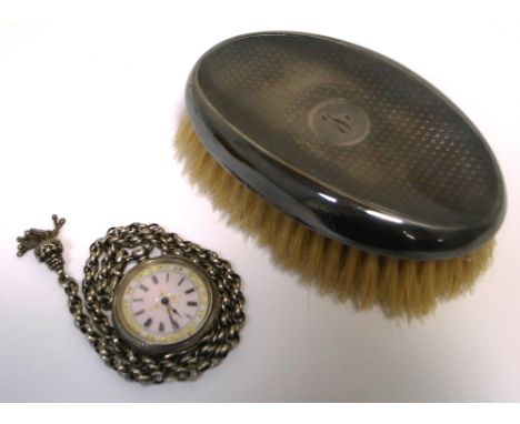 A Continental silver fob watch, enamel dial set with Roman numerals and border of gilt foliage on a white metal chain and a c