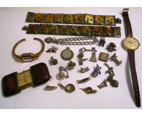 A silver charm bracelet, a small quantity of loose silver and white metal charms to include one modelled as windmill with blu