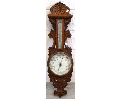 A 20th century oak wall hanging barometer.