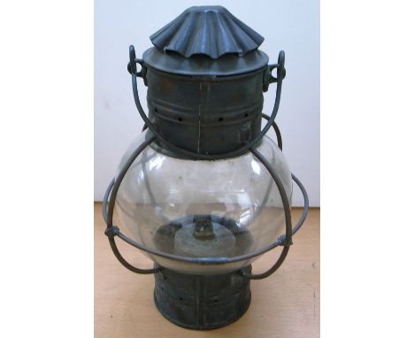 A brass ship's cabin globe lamp with stamped makers mark “Coal Salt & Tanning Co, Grimsby”, height 33cm.
