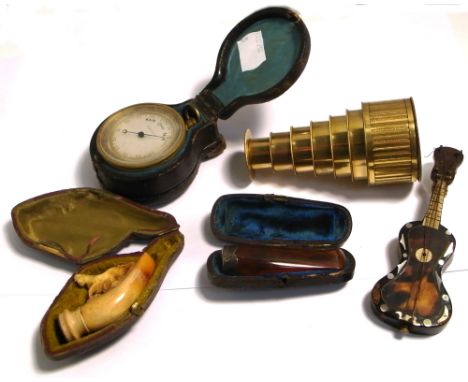 A cased amber and silver cigarette holder, a 19th century cased barometer and compass and a Watkins Charing Cross London five