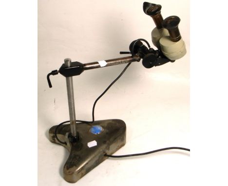 A Charles Baker, London, binocular microscope with working light.