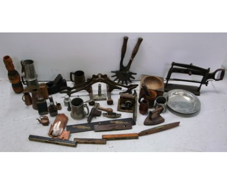 A quantity of tools and metalware to include spirit levels, planes, copper jugs, pewter tankards etc.