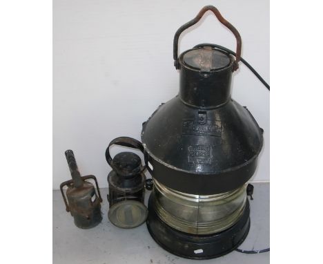 A Meteorite black painted ships lantern, height 72cm, a small black lamp and a vintage oil can (3).