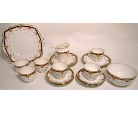 A white ground Royal Albert tea service comprising sups, saucers, tea plates, cake plate etc.