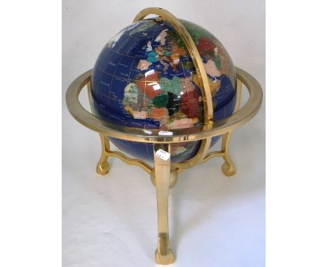 A contemporary brass framed lapis lazuli free standing globe.