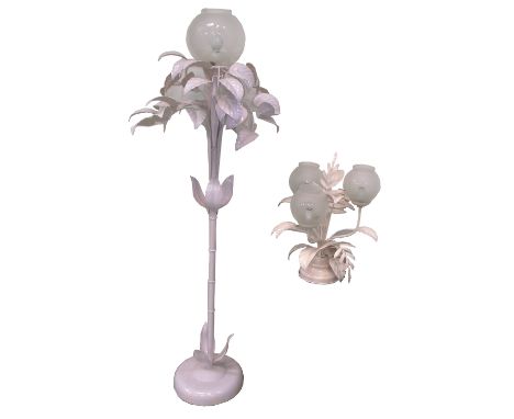 A retro pink painted standard lamp with leaves in relief, height 145cm and a matching table, height 50cm, both with rounded b