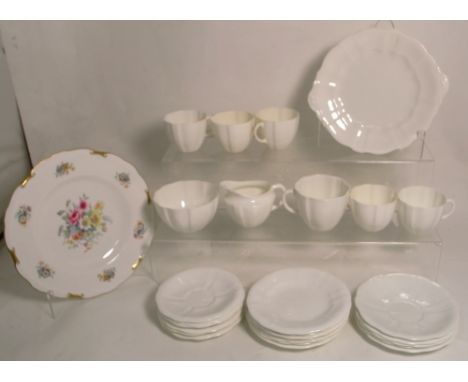 A Royal Crown Derby white part tea service and a Royal Crown Derby floral plate.