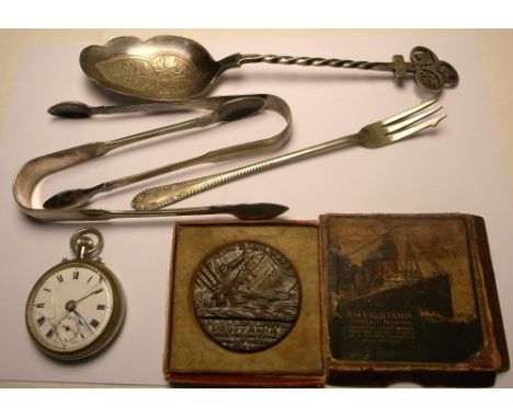 A collectors lot comprising boxed replica RMS Lusitania medal, a pair of hallmarked silver sugar tongs, a large silver plated