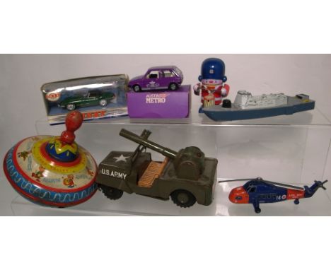 A vintage Chad Valley spinning top, a tin plate US Army jeep, a boxed 1968 E Type Jaguar, a boxed Corgi Special Edition Mini 