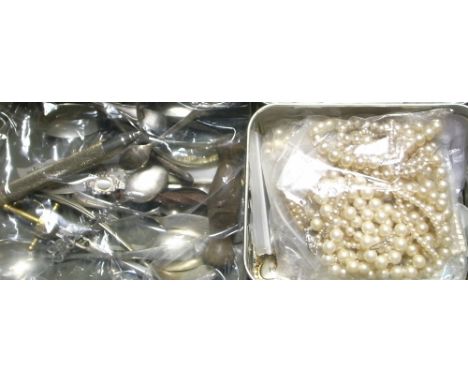 a small quantity of costume jewellery, mainly brooches and a small amount of flatware to include a hallmarked silver spoon an