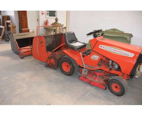 A Laser L95 36" Contracut ride on tractor mower c/w a collection box and a Westwood leaf sweeper , regularly serviced with se