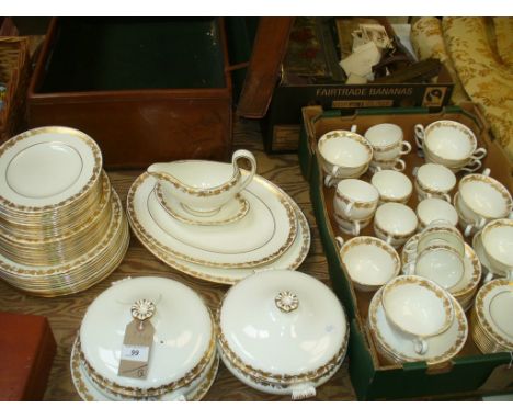An Extensive Wedgwood " Whitehall " tea and dinner service each piece with a gilt ivy leaf frieze, comprising dinner and side