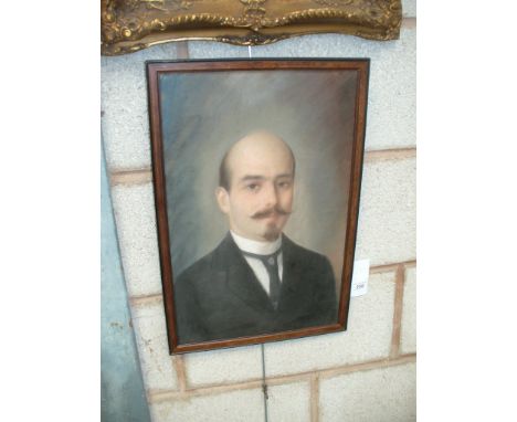 A 19th Century portrait of a gentleman, the painting depicting a young gentleman with beard and moustache, wearing frock coat