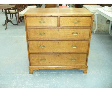 A 19th Century light oak chest of drawers with two short and three long graduated cockbeaded drawers , raised on bracket feet