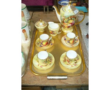 A Minton fruit pattern coffee service , comprising coffee pot, milk jug , sugar basin , four cups and saucers.