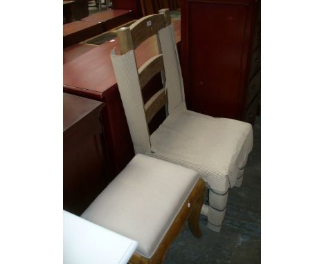 A Rustic pine ladder back kitchen chair and a light oak upholstered dressing stool. (2)