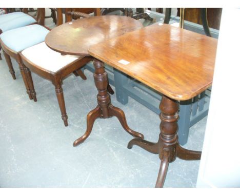 A Victorian mahogany tripod table with a ring turned baluster shaft and a second similar table with a circular top. (2)