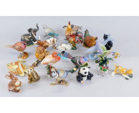 A large quantity of base metal boxes and covers, each modelled and decorated with enamel type decoration etc., in the form of