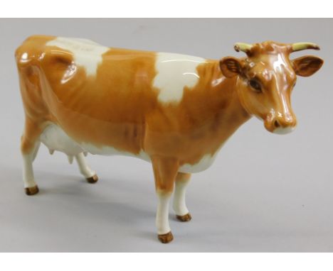 A Beswick Guernsey cow, 1st edition, gloss model number 1248A, 10.8cm high (boxed)